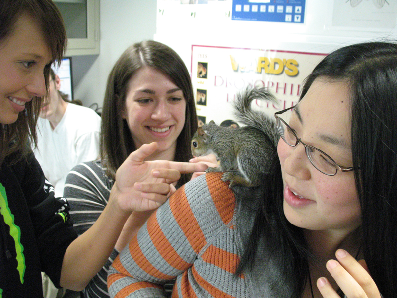 photo of students with squirrel